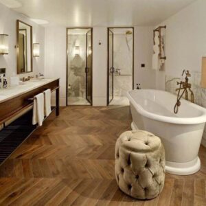wooden floor with a white bathtub