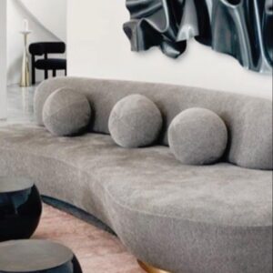 gray sofa with three pillows